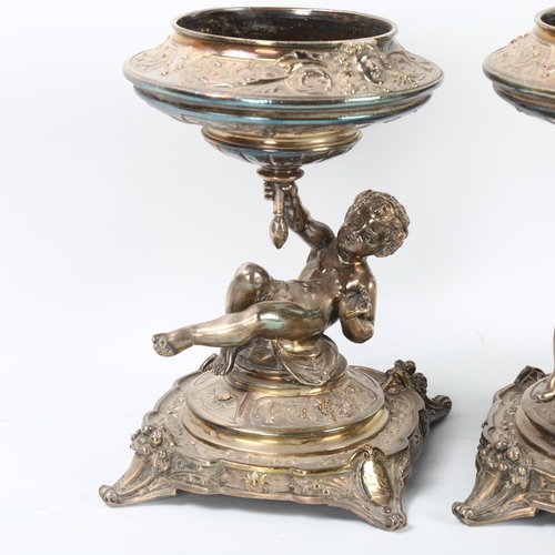 39 - ELKINGTON & CO - a pair of 19th century silver plate table centres, circa 1883, Bacchanalian putti s... 