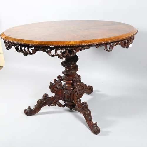 42 - A Regency walnut circular centre table, with central stained floral marquetry inlaid panel, egg and ... 