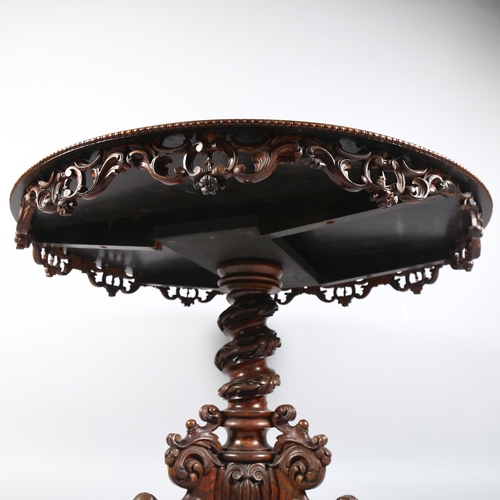 42 - A Regency walnut circular centre table, with central stained floral marquetry inlaid panel, egg and ... 