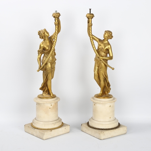 44 - A pair of 19th century Renaissance style gilt-bronze figural table centres, modelled as Classical la... 