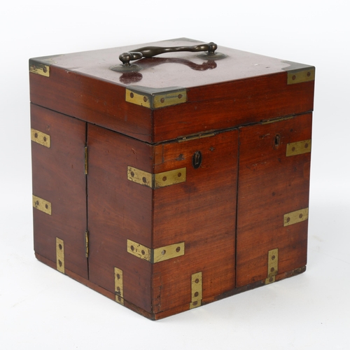 51 - A 19th century brass-bound mahogany travelling apothecary cabinet, with hinged lid and doors opening... 