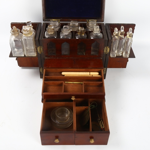 51 - A 19th century brass-bound mahogany travelling apothecary cabinet, with hinged lid and doors opening... 
