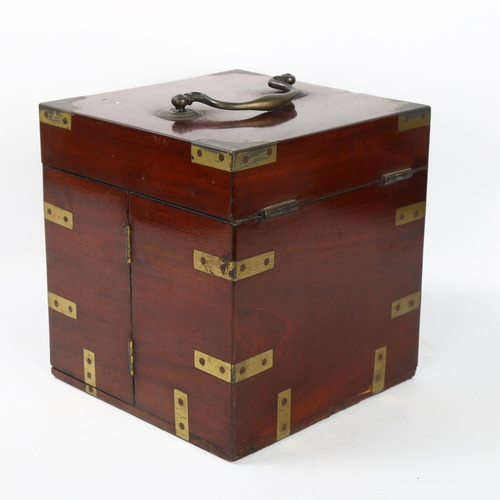 51 - A 19th century brass-bound mahogany travelling apothecary cabinet, with hinged lid and doors opening... 