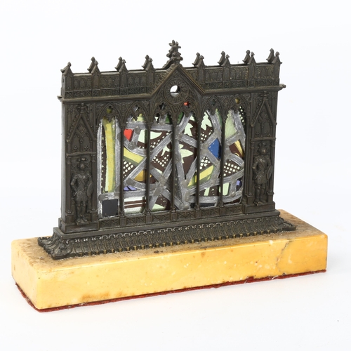 55 - A Gothic Revival patinated bronze stained glass table centre piece, depicting knights standing benea... 