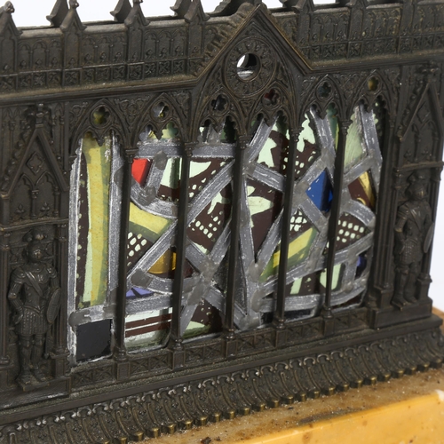 55 - A Gothic Revival patinated bronze stained glass table centre piece, depicting knights standing benea... 