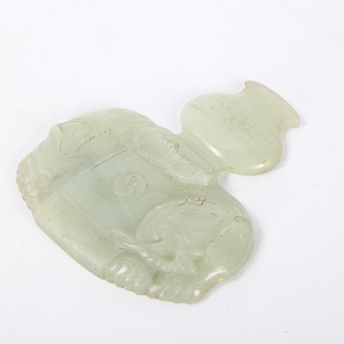 56 - A Chinese carved jade elephant amulet, and a lavender jade furniture mount, width 9cm (2)