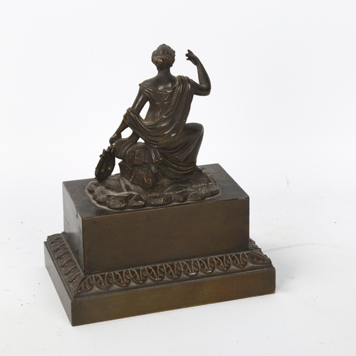 57 - A 19th century patinated bronze figural desk companion, with Classical lady cover opening to reveal ... 