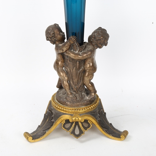 58 - A 19th century parcel-gilt silver plate cherub table centre epergne, with cobalt blue glass liner, h... 