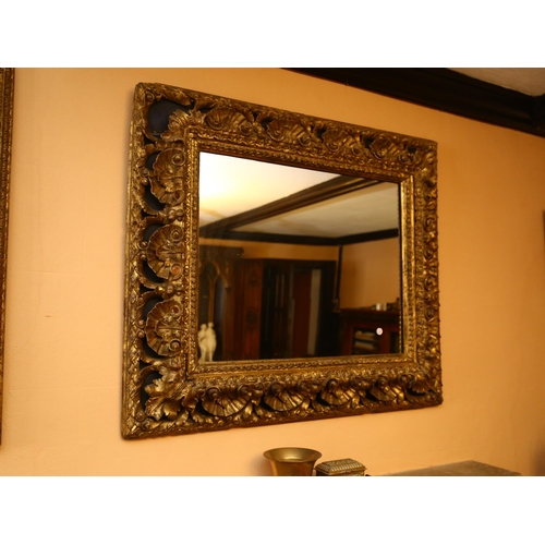 62 - A large gilt-gesso foliate rectangular wall mirror, overall 85cm x 98cm