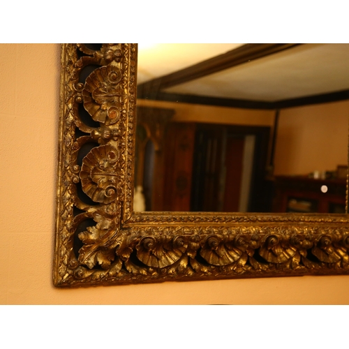 62 - A large gilt-gesso foliate rectangular wall mirror, overall 85cm x 98cm