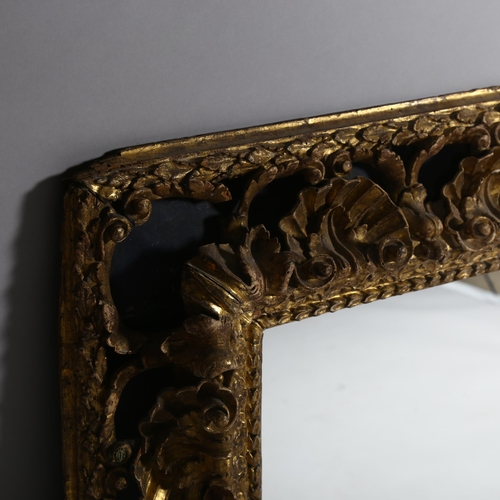 62 - A large gilt-gesso foliate rectangular wall mirror, overall 85cm x 98cm