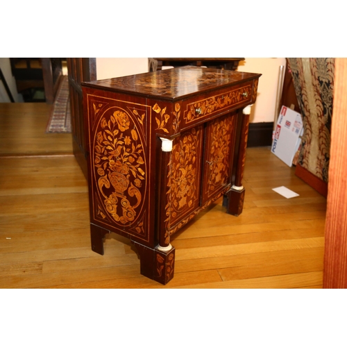 65 - A 19th century Dutch marquetry inlaid walnut sideboard, the top decorated with flowing basket of flo... 