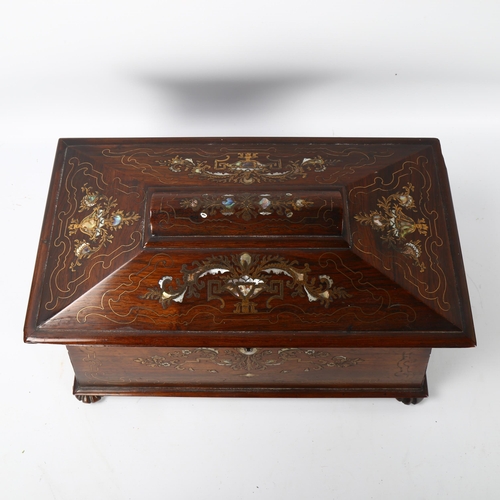 70 - A 19th century rosewood sarcophagus-shaped tea caddy, with inlaid brass and mother-of-pearl marquetr... 