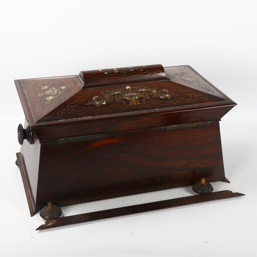 70 - A 19th century rosewood sarcophagus-shaped tea caddy, with inlaid brass and mother-of-pearl marquetr... 