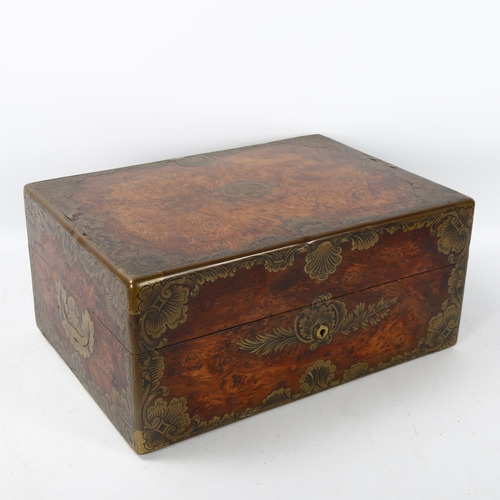 81 - 19th century French amboyna and brass-bound travelling case, armorial brass crest to the lid 