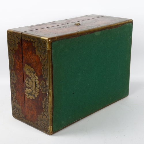 81 - 19th century French amboyna and brass-bound travelling case, armorial brass crest to the lid 