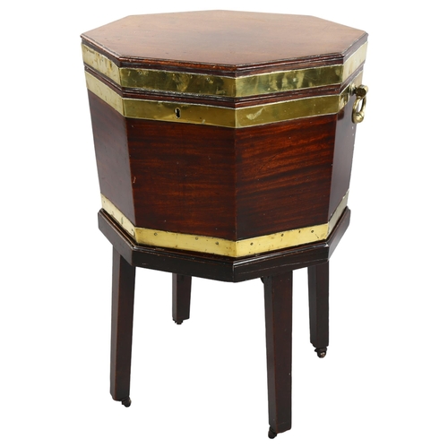 270 - A George III brass-bound mahogany wine cooler of octagonal form, brass drop handles, on separate sta... 