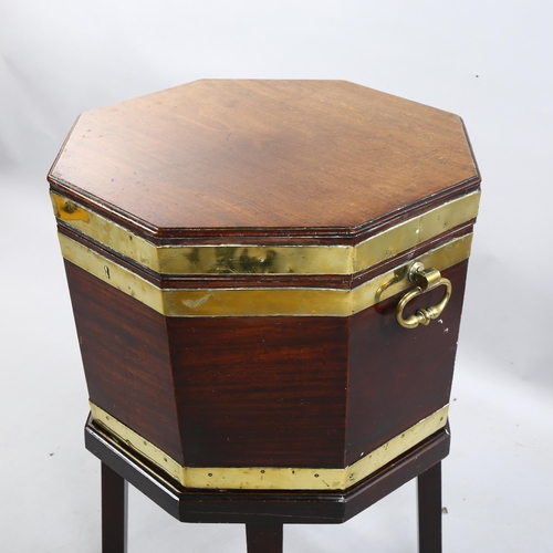 270 - A George III brass-bound mahogany wine cooler of octagonal form, brass drop handles, on separate sta... 