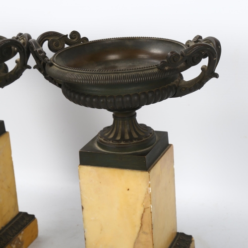 131 - A pair of 19th century bronze tazza urns on Sienna marble plinths, height 23.5cm