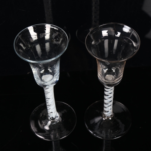 132 - 2 similar 18th century cordial glasses with milk twist stems, height 17cm