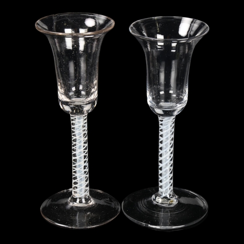 133 - 2 similar 18th century cordial glasses with milk twist stems, height 17cm