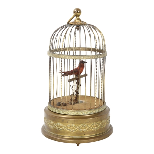 138 - A clockwork bird-in-a-cage automaton, height excluding ring handle 28cm, working order