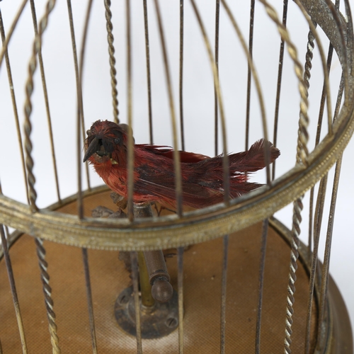 138 - A clockwork bird-in-a-cage automaton, height excluding ring handle 28cm, working order