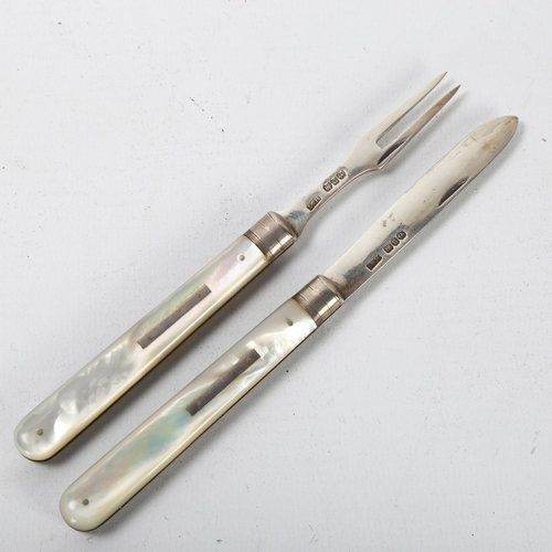 142 - A Victorian folding fruit knife and fork set, both hallmarked Birmingham 1894, maker H&T, mother of ... 