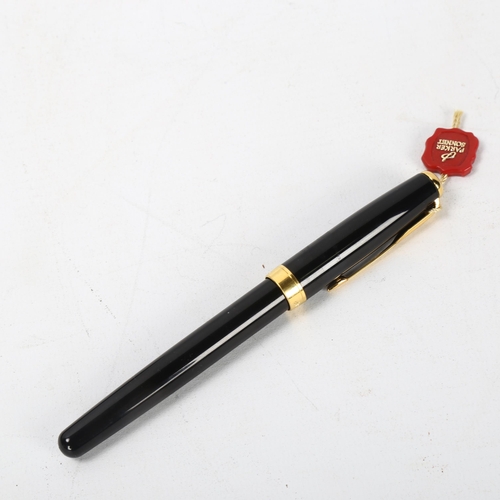 158 - A Parker Sonnet fountain pen, black body with gold metal trim, 18k nib, boxed with papers