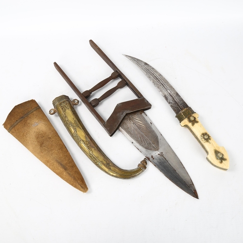 169 - **WITHDRAWN** A Middle Eastern Katar dagger, with inlaid steel handle and cloth-covered sheath, leng... 