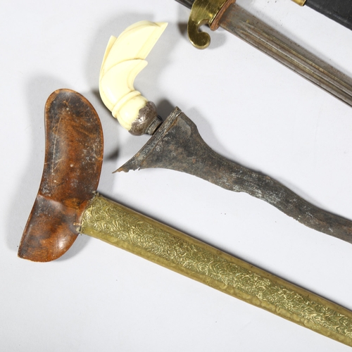 171 - **WITHDRAWN** 2 Malayan Kris daggers, and another brass-mounted dagger, all with original sheaths (3... 