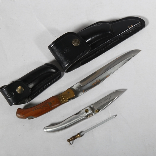 173 - **WITHDRAWN** A Laguiole folding knife, and a smaller pocket knife, leather scabbards (2)