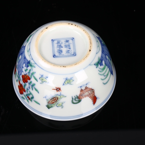 180 - A Chinese porcelain chicken cup, hand painted decoration and 6 character mark, diameter 8cm