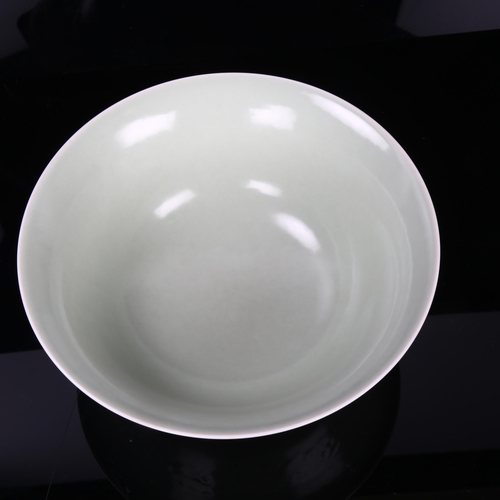 182 - A Chinese celadon porcelain bowl, relief moulded frieze and seal mark, diameter 22cm