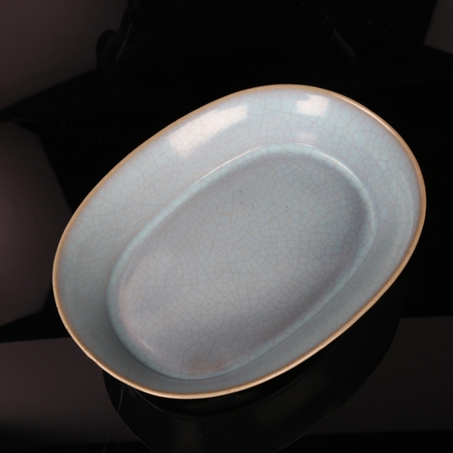 185 - A Chinese pale blue glaze celadon porcelain bowl, length 23cm