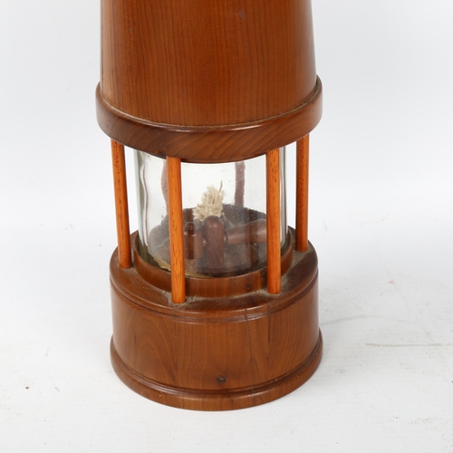 189 - An unusual yew wood miner's lamp, height excluding handle 23cm