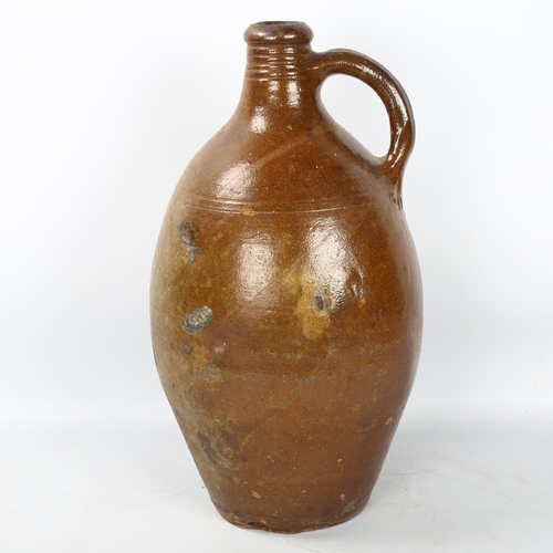 192 - A Rhenish salt glaze stoneware flagon, 18th century, height 38cm