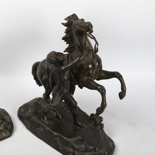 195 - A pair of spelter Marley horse ornaments, height 18cm (1 A/F)