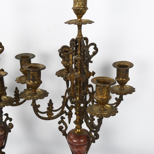 196 - A pair of French gilt-brass and rouge marble candelabra, circa 1900, height 56cm