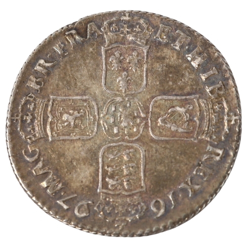 219 - A William III silver shilling dated 1697, 6g, diameter 25.4mm