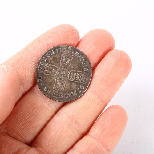 219 - A William III silver shilling dated 1697, 6g, diameter 25.4mm