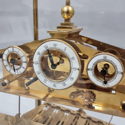 266 - A 20th century brass Congreve clock, with rolling ball fusee movement housed in glass display cabine... 