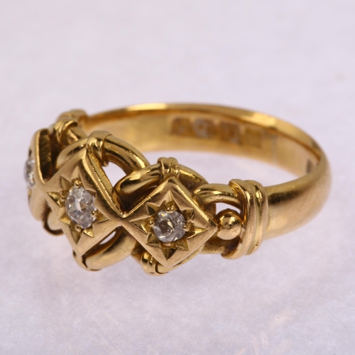 1101 - An early 20th century 18ct gold three-stone diamond ring, star set with old-cut diamonds and curb li... 