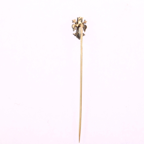 1104 - A 19th century diamond fleur-de-lis stickpin, unmarked gold and silver settings with rose-cut diamon... 