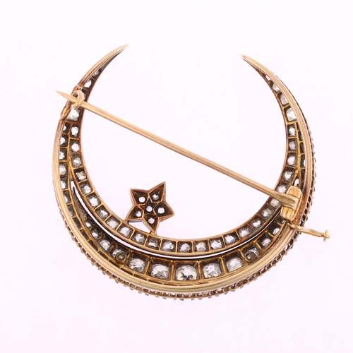 1111 - A large Victorian diamond star and crescent moon brooch, circa 1880, the crescent formed of a centra... 