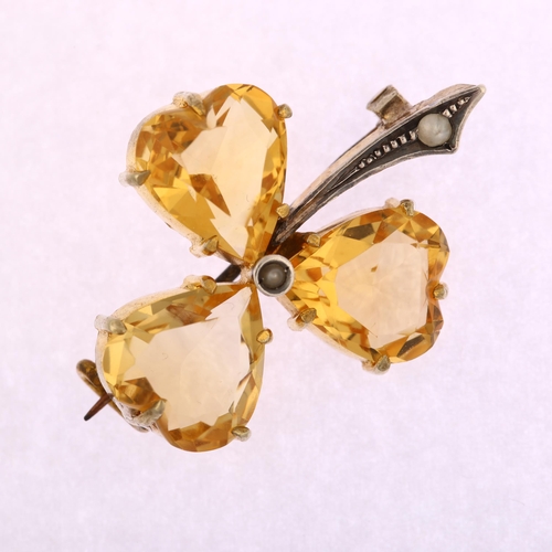 1117 - An Edwardian citrine and pearl shamrock brooch, circa 1905, unmarked gilt white metal settings with ... 