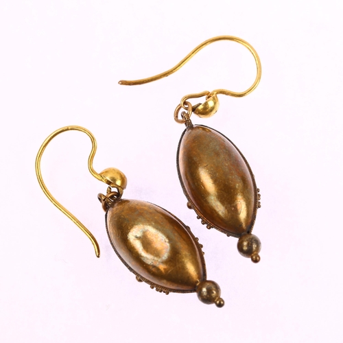 1121 - A pair of Victorian Etruscan Revival bombe drop earrings, circa 1870, unmarked gold settings with ap... 