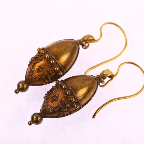 1121 - A pair of Victorian Etruscan Revival bombe drop earrings, circa 1870, unmarked gold settings with ap... 