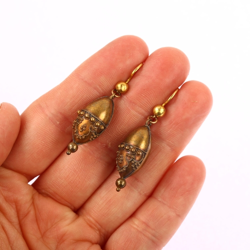 1121 - A pair of Victorian Etruscan Revival bombe drop earrings, circa 1870, unmarked gold settings with ap... 