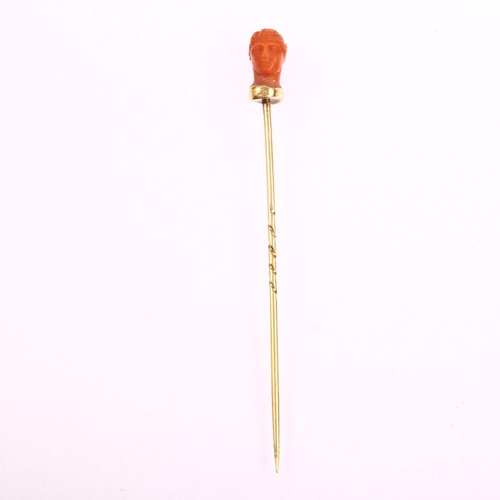 1122 - An Italian 19th century coral head stickpin, circa 1870, unmarked gold settings, head height 11.7mm,... 